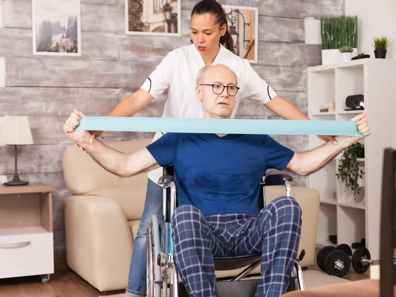 A licensed physical therapist supporting a patient through balance and walking practice in the clinic