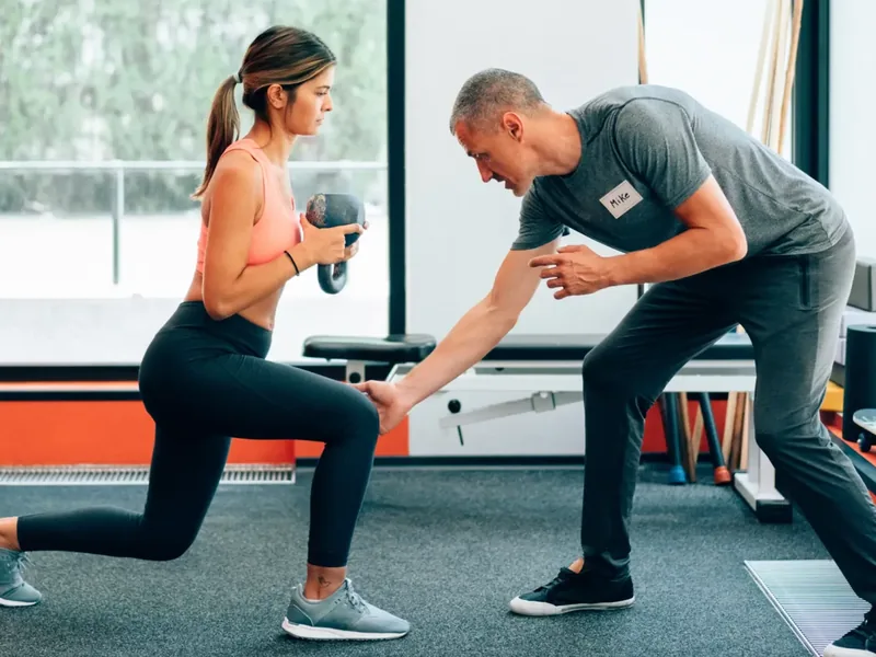 Patient performing progressive strength training under supervision