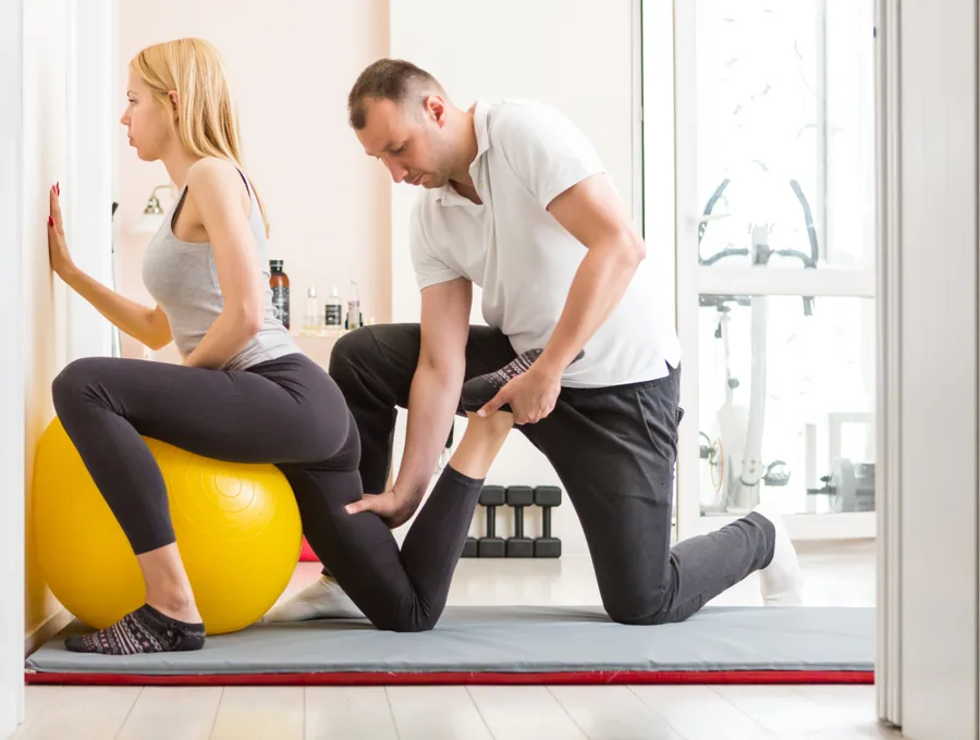 Physical therapist guiding a patient through a one-on-one session